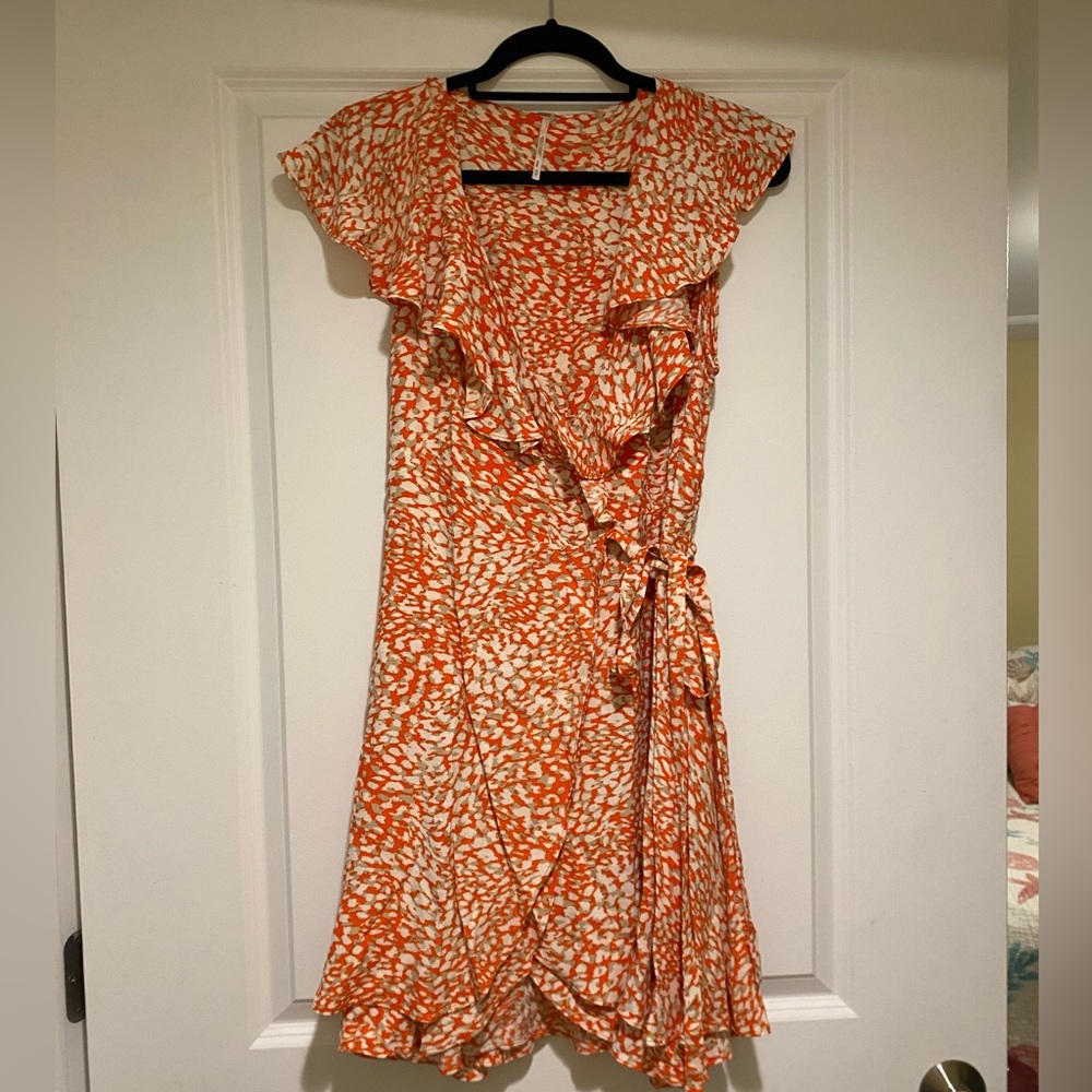 Free people. Wrap around dress. Orange/cream. Women’s size medium.